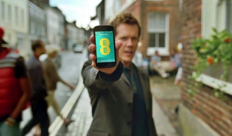 EE £2.7m fine - Kevin Bacon holds EE phone