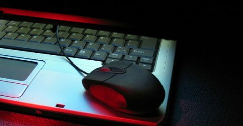 photo of a laptop with a mouse